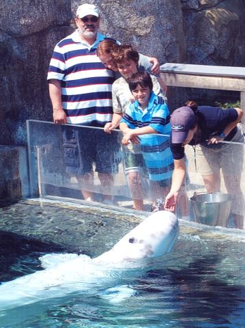 Family with Keela the Baluga cropped