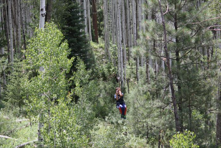 Jonathan takes picture while zipping