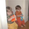 Robert and Jonathan sit on the steps and read&nbsp;