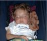 Robert (with the golden hair) sleeps in the pram with his Teddy