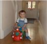 Jonathan rides the fire engine down the hall.&nbsp;