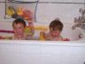 Jonathan and Robert splash in the tub