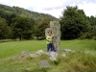 Jonathan by a stone cross