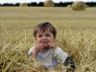 Jonathan sits in the hay