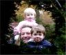Nancy and Robert look through the bushes.  Danielle looks too.