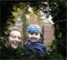 Nancy and Jonathan look through the bushes