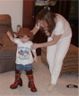 Jonathan tries on Sheila's boots and hat