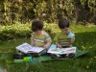 Robert and Jonathan read on the lawn
