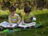 Robert and Jonathan read on the lawn
