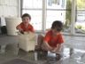 Jonathan and Robert help mom clean the porch