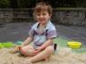 Robert plays in the sand (on the driveway)