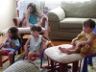 Arielle and Nicole watch TV with Jonathan and Robert