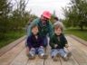 Ian, Jonathan and Robert ride through the apple orchard