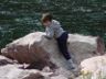Robert climbs a rock by the Green River at Flaming Gorge