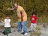 Ian showing Robert and Jonathan how to skim stones