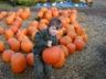 Robert lifts a big pumpkin