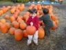 Jonathan lifts a pumpkin