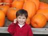 Jonathan by the pumpkin cart
