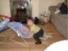 Cousin Kayla eyes the bouncy seat