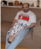 Robert lies on daddy's lap