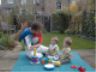 Beatriz reads to the boys outside