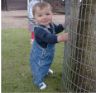 Jonathan stands by a tree&nbsp;