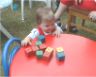 Robert, some blocks and a red table